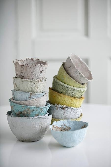 Stacked colorful papier-mâché bowls
