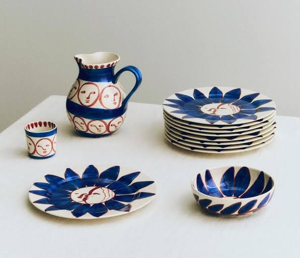 Hand-painted studio pottery tableware set with sun motifs