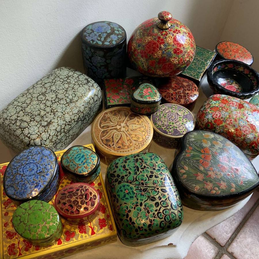 Collection of hand-painted papier-mâché boxes in floral designs