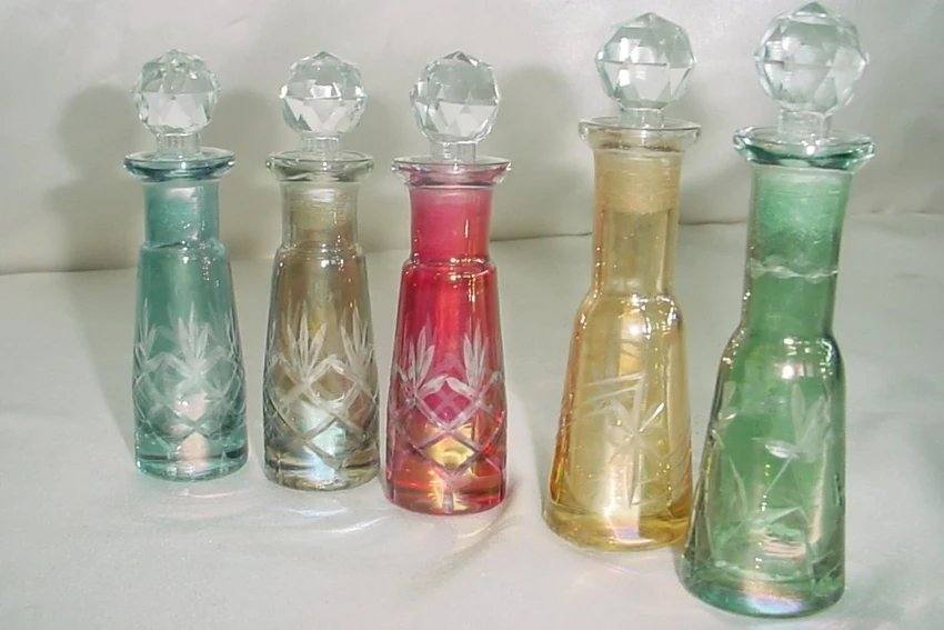 Hand-cut colored glass perfume bottles with crystal stoppers