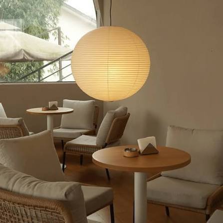 Round paper lantern pendant light in a cafe
