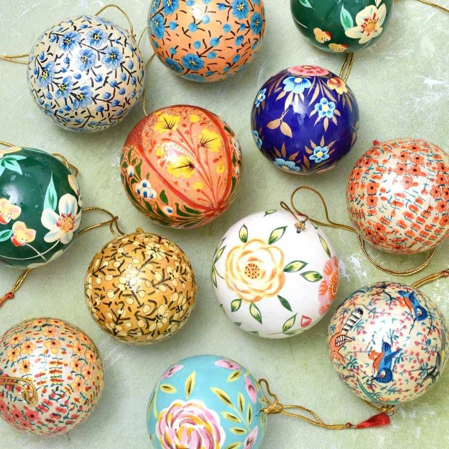 Assorted hand-painted papier-mâché decorative baubles