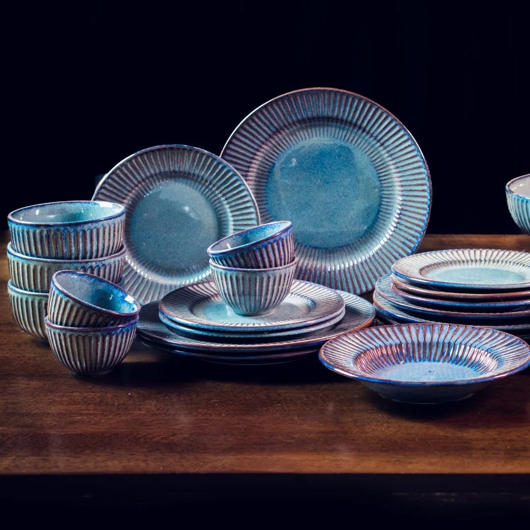Reactive-glaze blue ceramic dinner set with plates, bowls and cups